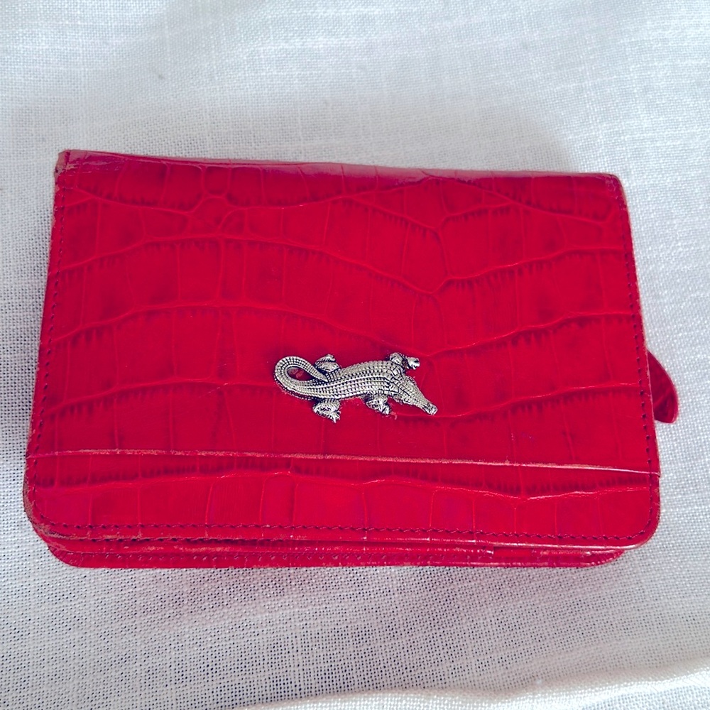 Red wallet alligator 🐊 on front many pockets and places  for credit cards ID
